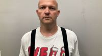 City man who brandished gun at phone store remains held on no bail