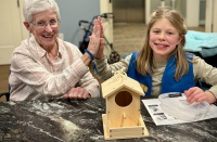 Girl Scouts bring cheer to seniors and learn a lot in the process!